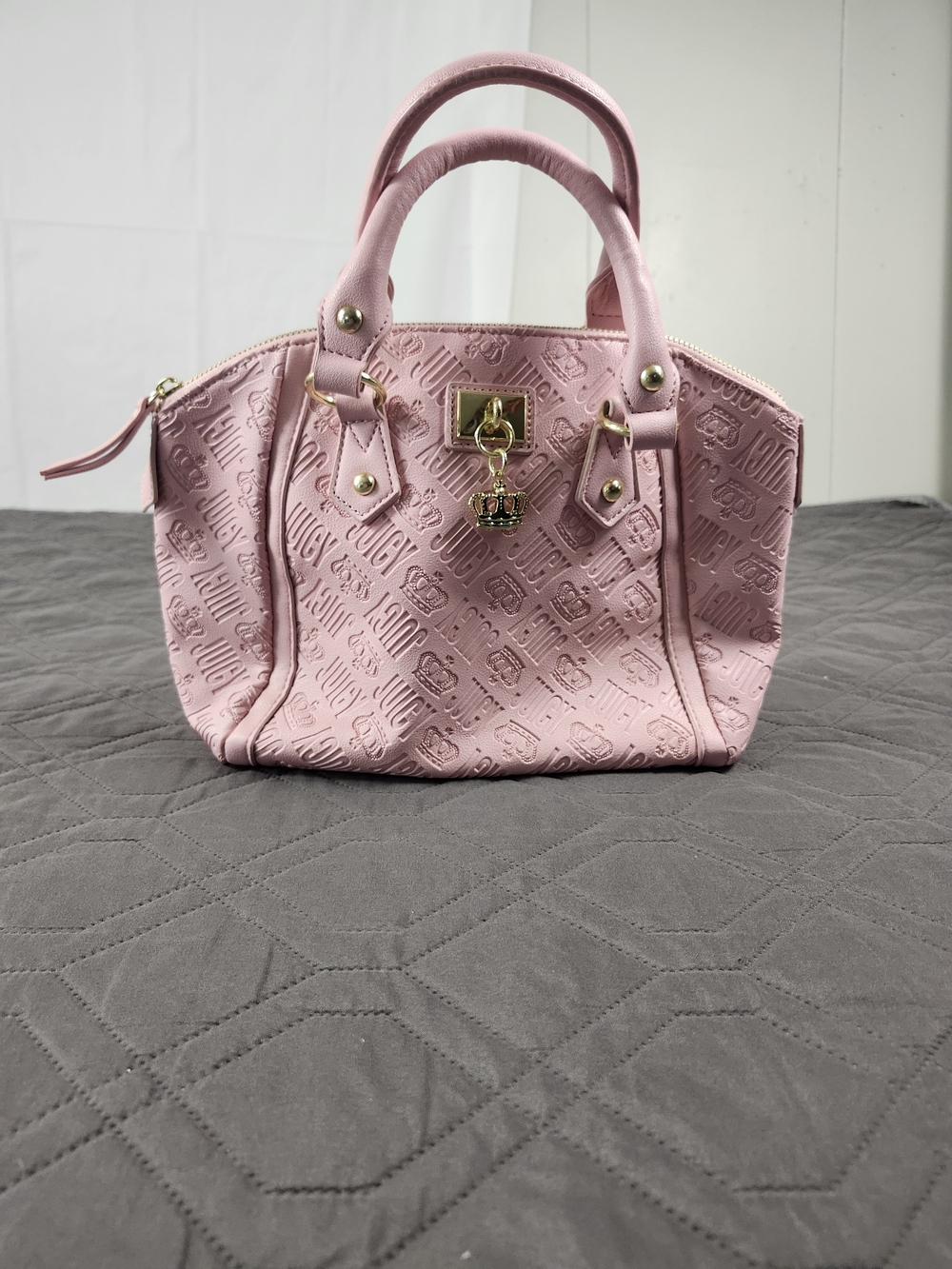 pink embossed Juicy Couture mini crossbody satchel hanging gold crown charm